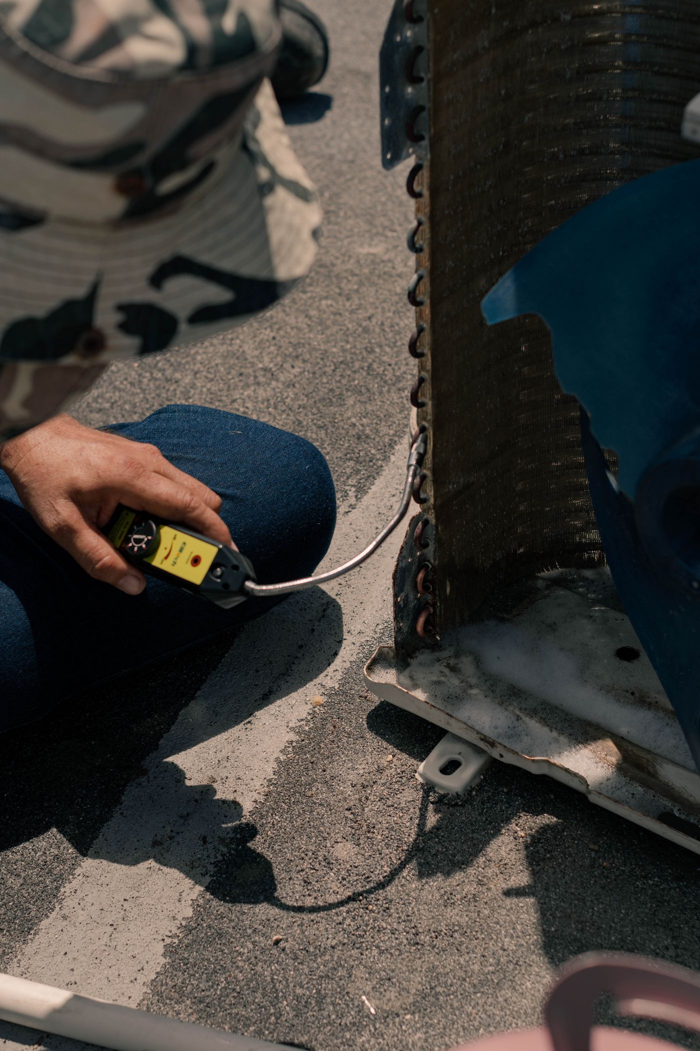 A technician inspecting cooling equipment