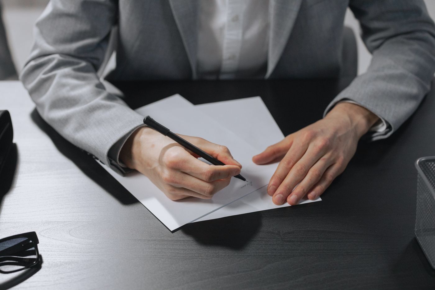 A document being signed at a desk